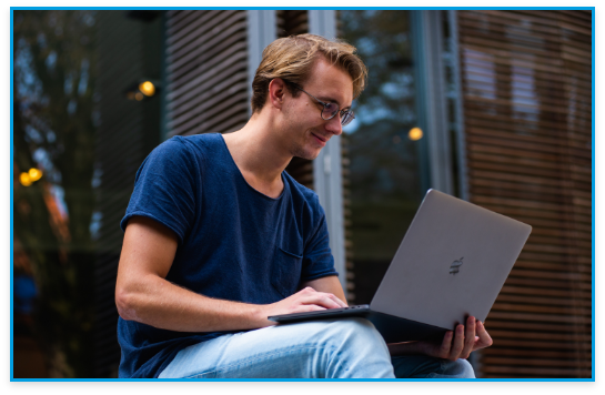 a student on his laptop