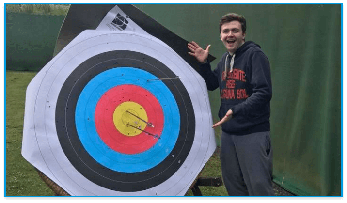 a student at an archery activity